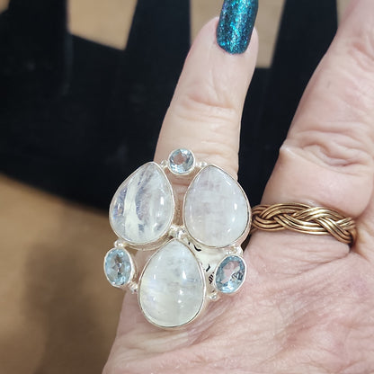 Assorted sterling silver rings featuring unique genuine gemstones in various shapes and colors, displayed on a white background. Perfect for crystal energy, personal style, and one-of-a-kind magic.