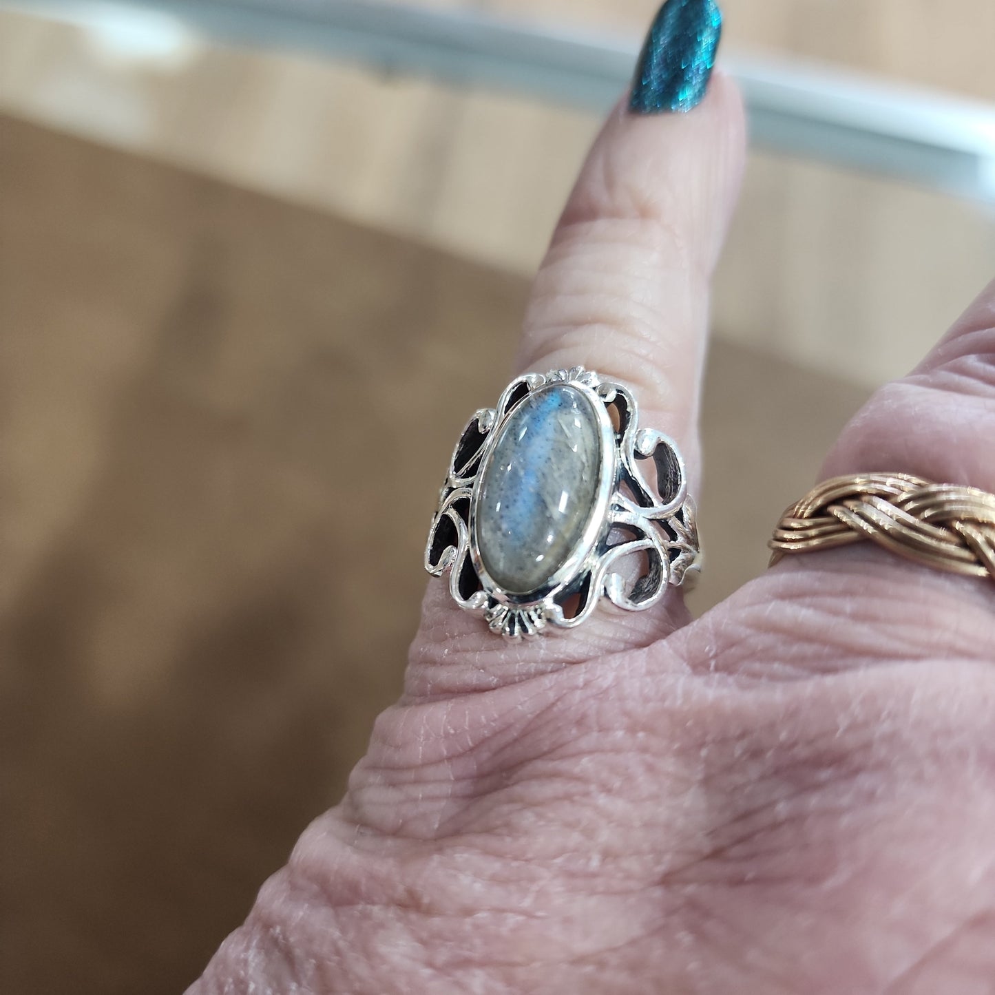 Assorted sterling silver rings featuring unique genuine gemstones in various shapes and colors, displayed on a white background. Perfect for crystal energy, personal style, and one-of-a-kind magic.