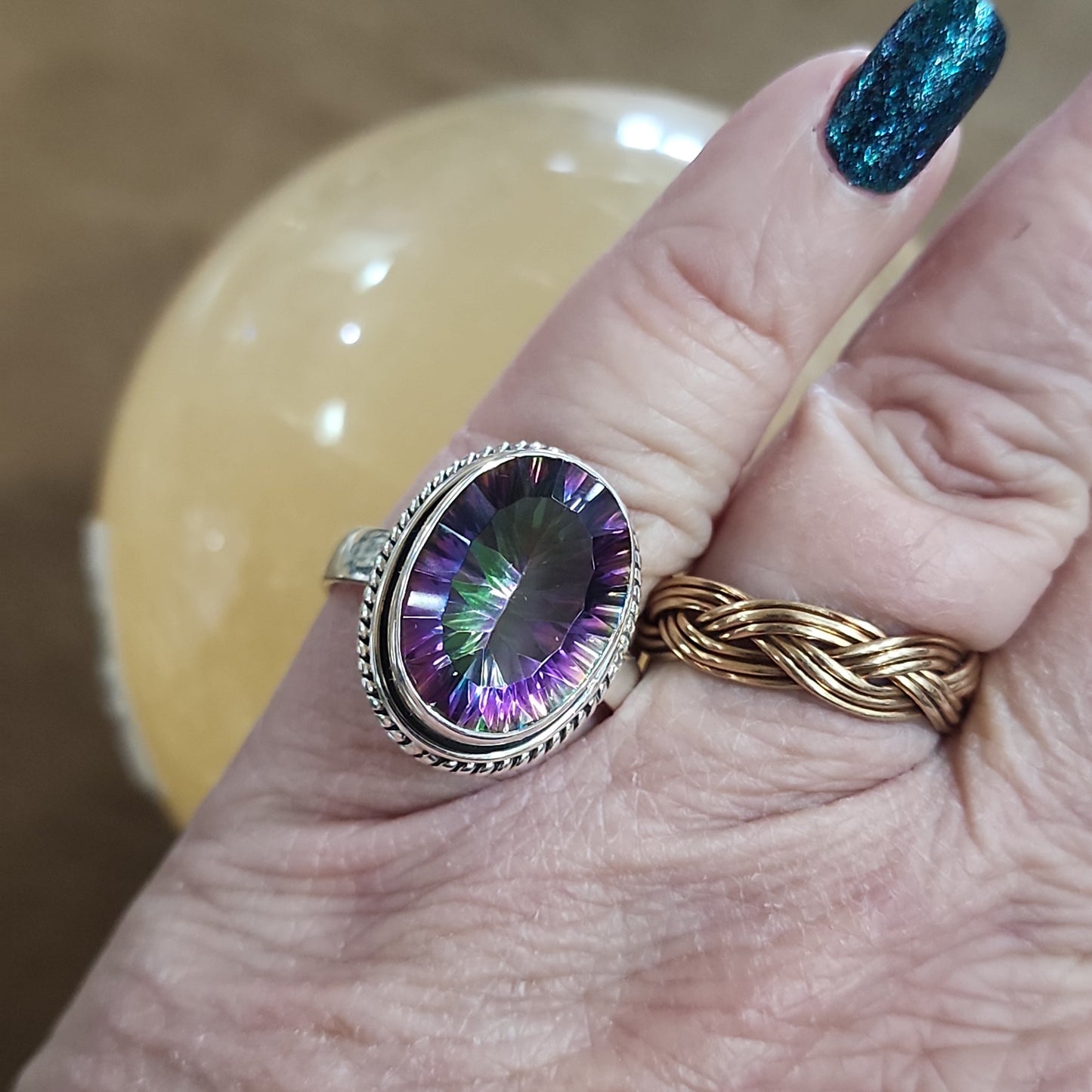 Assorted sterling silver rings featuring unique genuine gemstones in various shapes and colors, displayed on a white background. Perfect for crystal energy, personal style, and one-of-a-kind magic.

