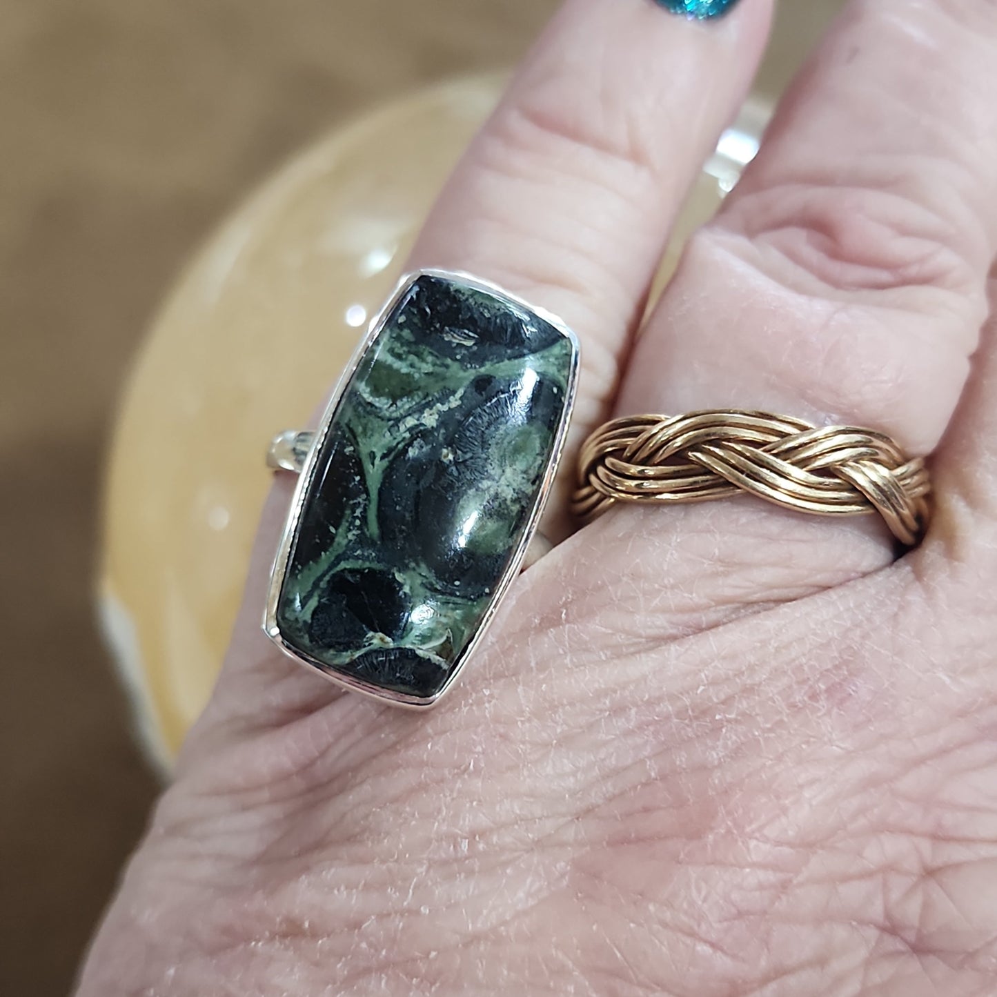 Assorted sterling silver rings featuring unique genuine gemstones in various shapes and colors, displayed on a white background. Perfect for crystal energy, personal style, and one-of-a-kind magic.

