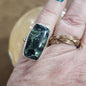 Assorted sterling silver rings featuring unique genuine gemstones in various shapes and colors, displayed on a white background. Perfect for crystal energy, personal style, and one-of-a-kind magic.

