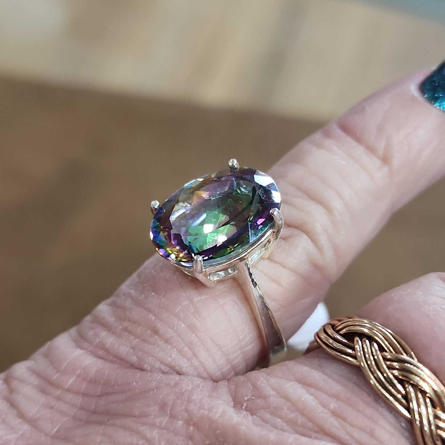 Assorted sterling silver rings featuring unique genuine gemstones in various shapes and colors, displayed on a white background. Perfect for crystal energy, personal style, and one-of-a-kind magic.