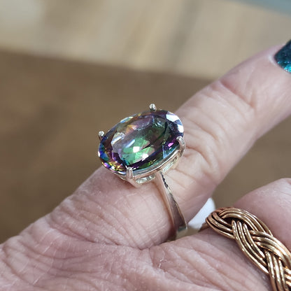 Assorted sterling silver rings featuring unique genuine gemstones in various shapes and colors, displayed on a white background. Perfect for crystal energy, personal style, and one-of-a-kind magic.