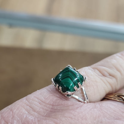 Assorted sterling silver rings featuring unique genuine gemstones in various shapes and colors, displayed on a white background. Perfect for crystal energy, personal style, and one-of-a-kind magic.