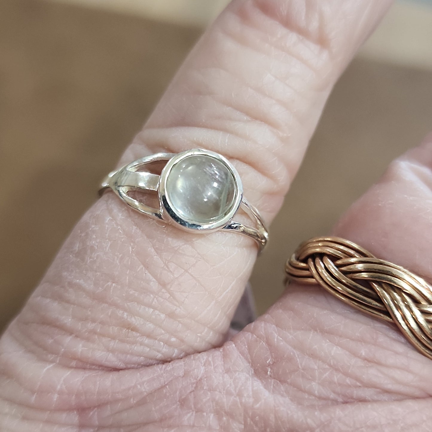 Assorted sterling silver rings featuring unique genuine gemstones in various shapes and colors, displayed on a white background. Perfect for crystal energy, personal style, and one-of-a-kind magic.