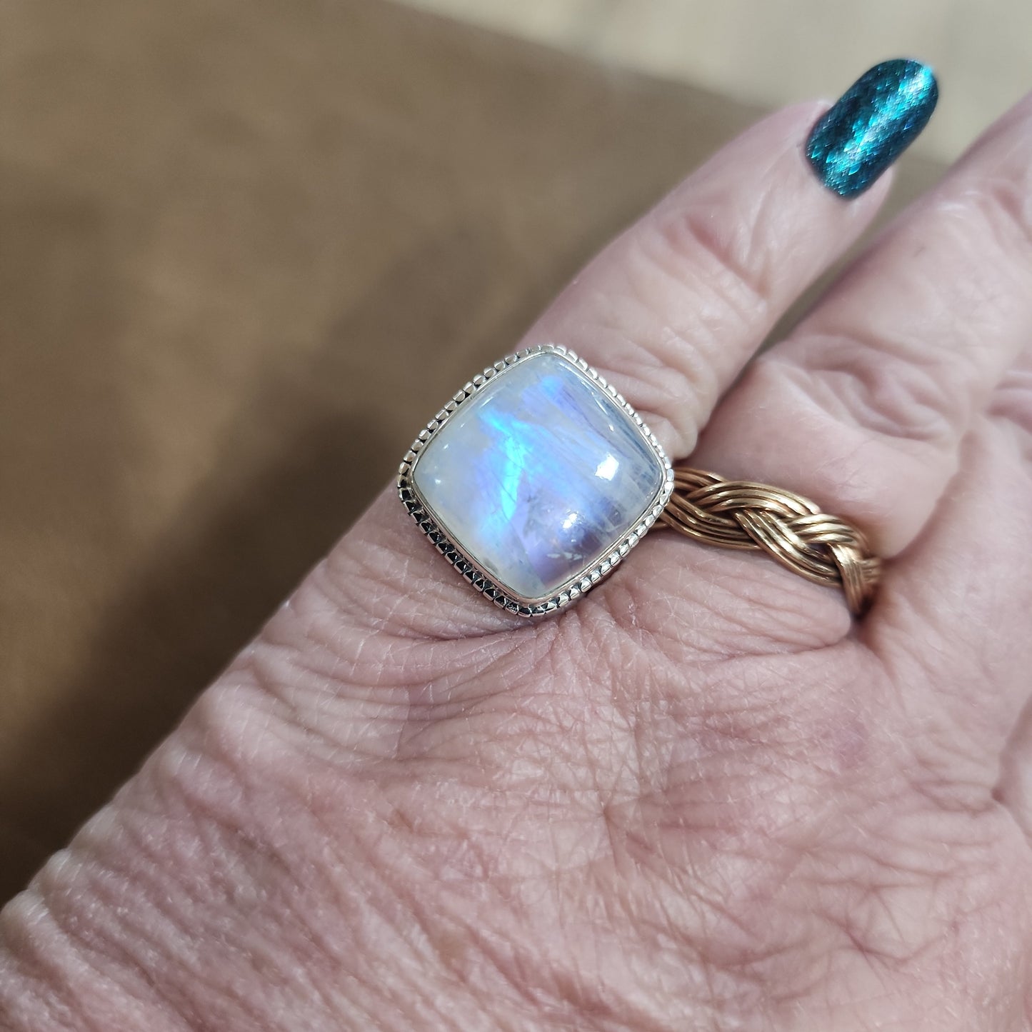 Assorted sterling silver rings featuring unique genuine gemstones in various shapes and colors, displayed on a white background. Perfect for crystal energy, personal style, and one-of-a-kind magic.