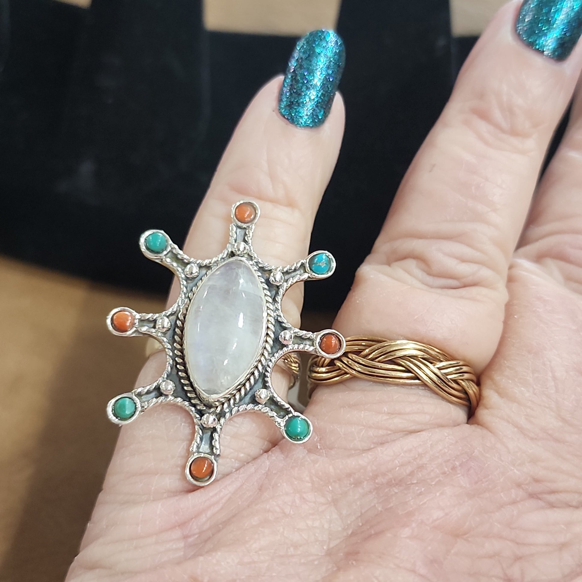 Assorted sterling silver rings featuring unique genuine gemstones in various shapes and colors, displayed on a white background. Perfect for crystal energy, personal style, and one-of-a-kind magic.