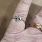 Assorted sterling silver rings featuring unique genuine gemstones in various shapes and colors, displayed on a white background. Perfect for crystal energy, personal style, and one-of-a-kind magic.
