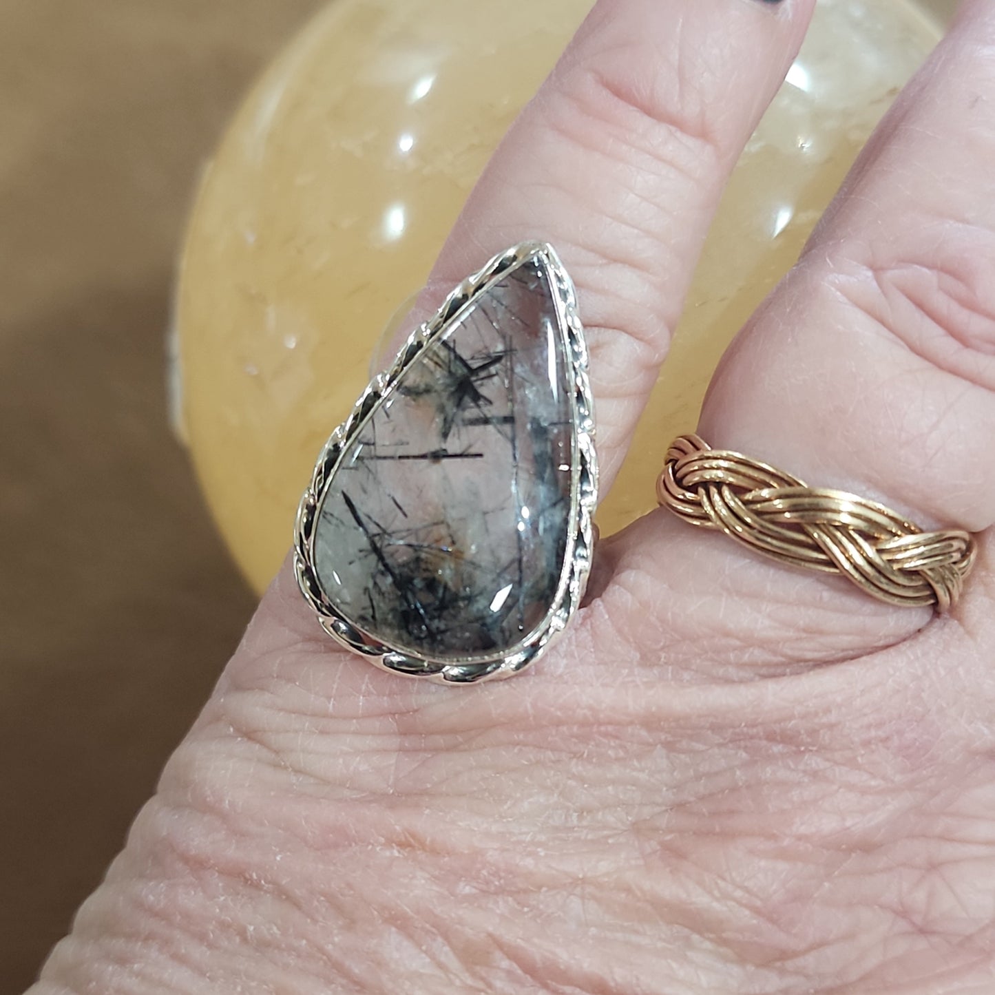 Assorted sterling silver rings featuring unique genuine gemstones in various shapes and colors, displayed on a white background. Perfect for crystal energy, personal style, and one-of-a-kind magic.

