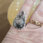 Assorted sterling silver rings featuring unique genuine gemstones in various shapes and colors, displayed on a white background. Perfect for crystal energy, personal style, and one-of-a-kind magic.

