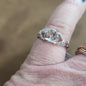 Assorted sterling silver rings featuring unique genuine gemstones in various shapes and colors, displayed on a white background. Perfect for crystal energy, personal style, and one-of-a-kind magic.