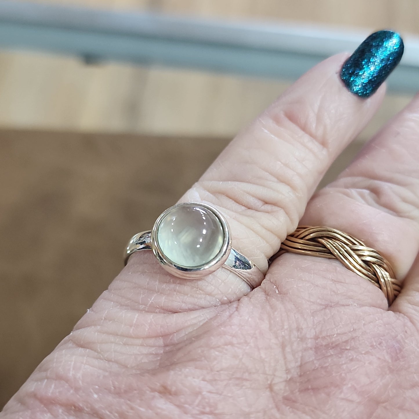 Assorted sterling silver rings featuring unique genuine gemstones in various shapes and colors, displayed on a white background. Perfect for crystal energy, personal style, and one-of-a-kind magic.