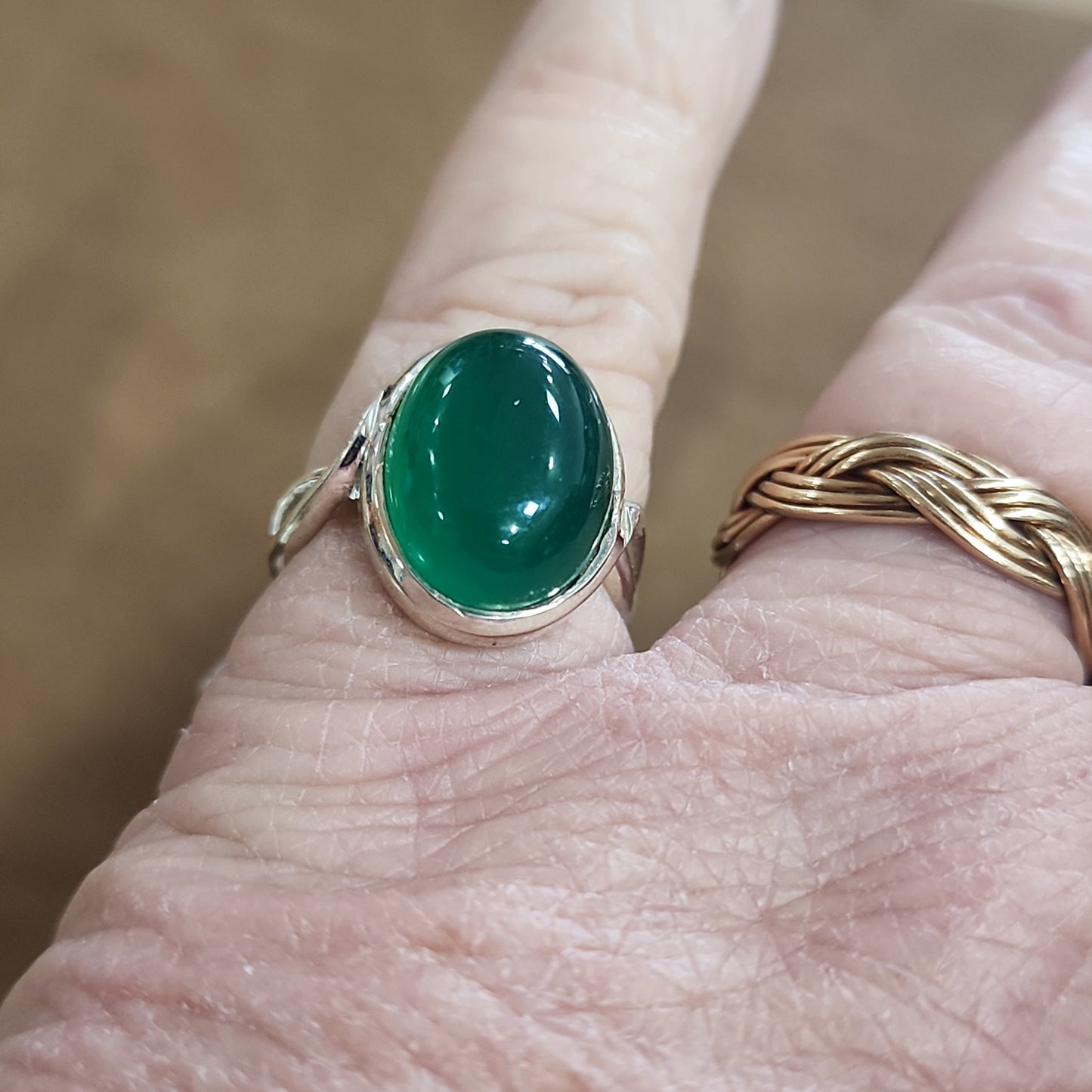 Assorted sterling silver rings featuring unique genuine gemstones in various shapes and colors, displayed on a white background. Perfect for crystal energy, personal style, and one-of-a-kind magic.