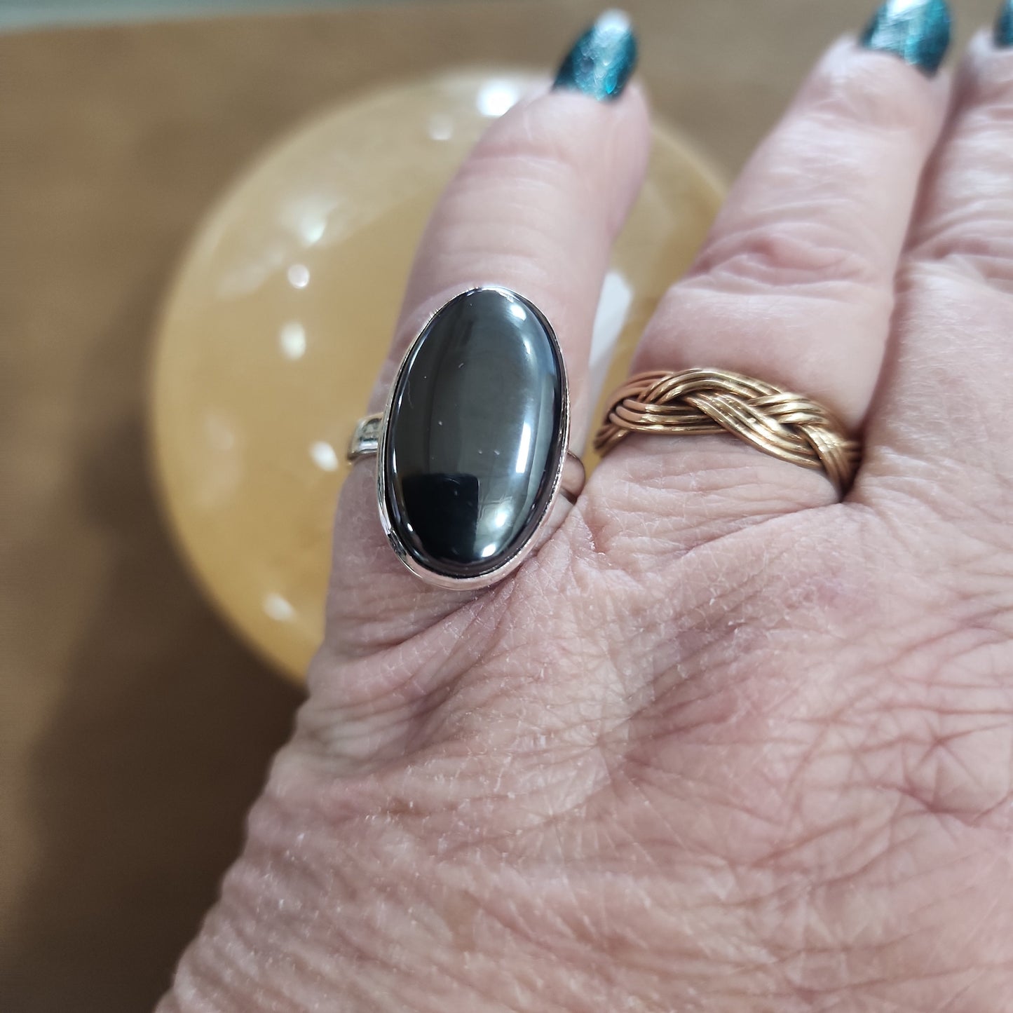 Assorted sterling silver rings featuring unique genuine gemstones in various shapes and colors, displayed on a white background. Perfect for crystal energy, personal style, and one-of-a-kind magic.

