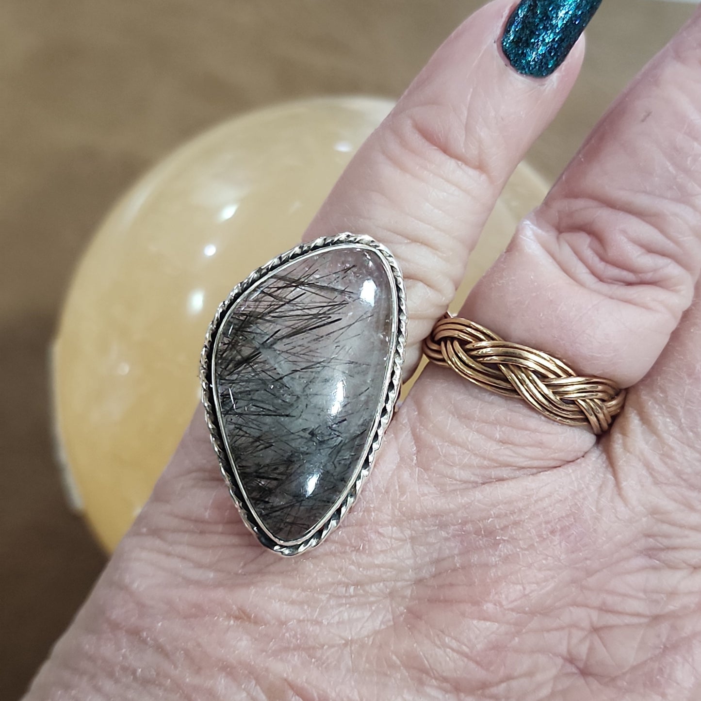 Assorted sterling silver rings featuring unique genuine gemstones in various shapes and colors, displayed on a white background. Perfect for crystal energy, personal style, and one-of-a-kind magic.

