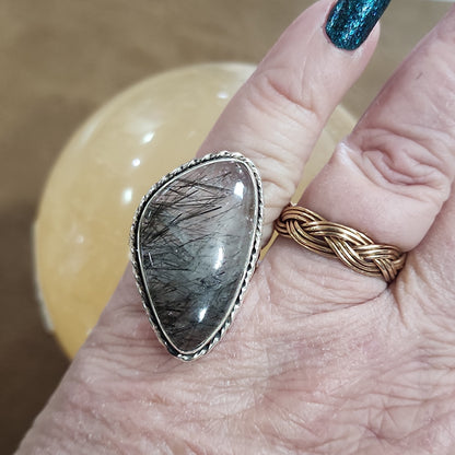Assorted sterling silver rings featuring unique genuine gemstones in various shapes and colors, displayed on a white background. Perfect for crystal energy, personal style, and one-of-a-kind magic.

