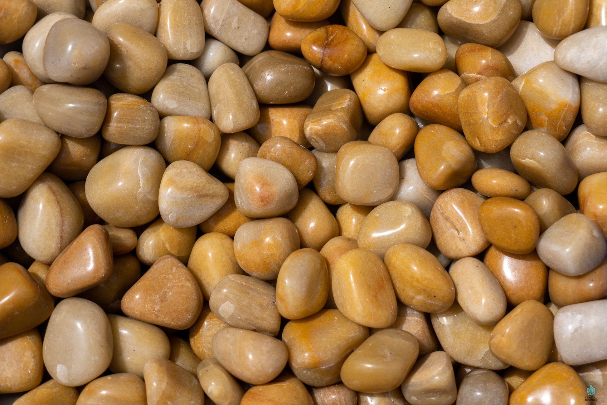 Polished yellow aventurine tumble with warm golden hues, displayed on a white background. Perfect for optimism, empowerment, and solar plexus energy.