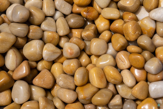 Polished yellow aventurine tumble with warm golden hues, displayed on a white background. Perfect for optimism, empowerment, and solar plexus energy.